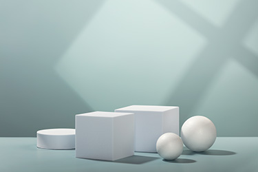 drie dimensies in wiskundige theorie. Afbeelding toont bvb een cubus en een bol.