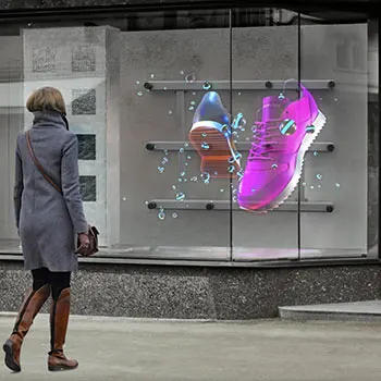 Een digitale display toont 3D-mode-items in een etalage. Een voorbeeld van 3d visuele communicatie.
